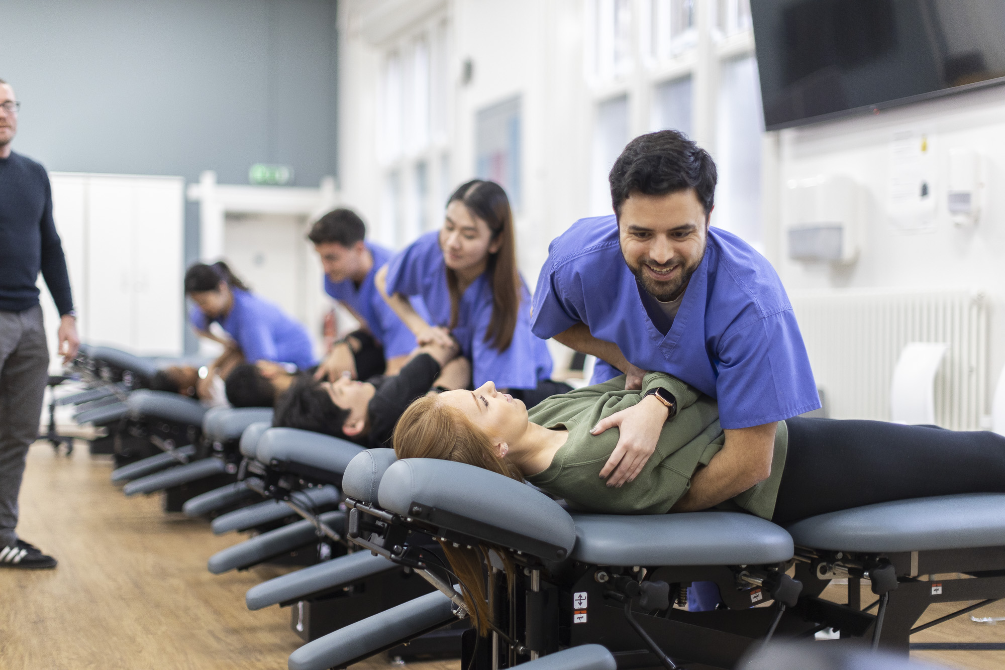 Chiropractic final year students in TR2 practising techniques