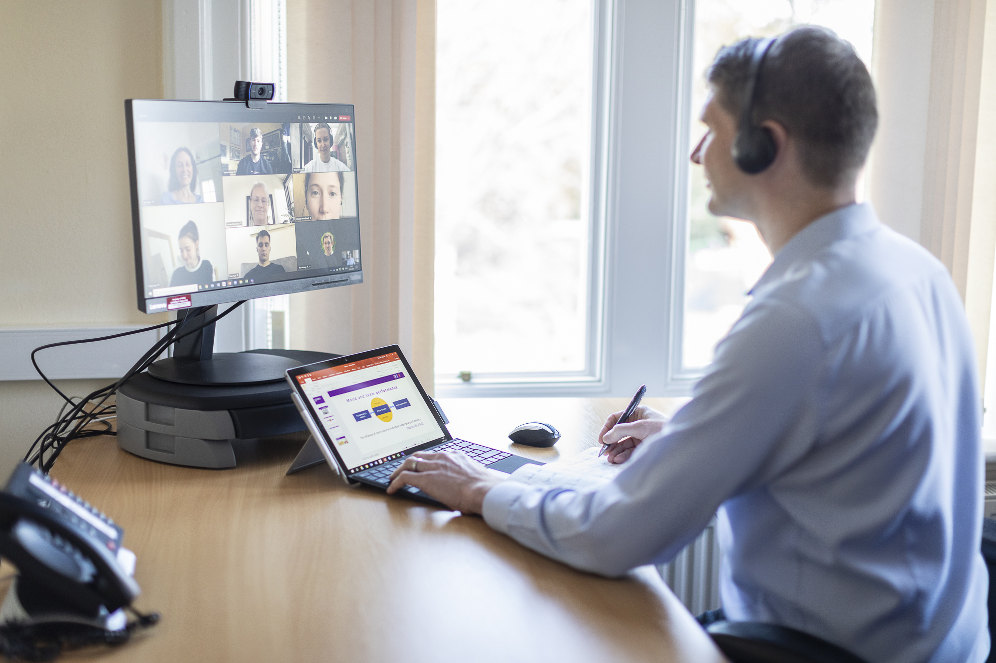 Lecturer teaching class via an online call