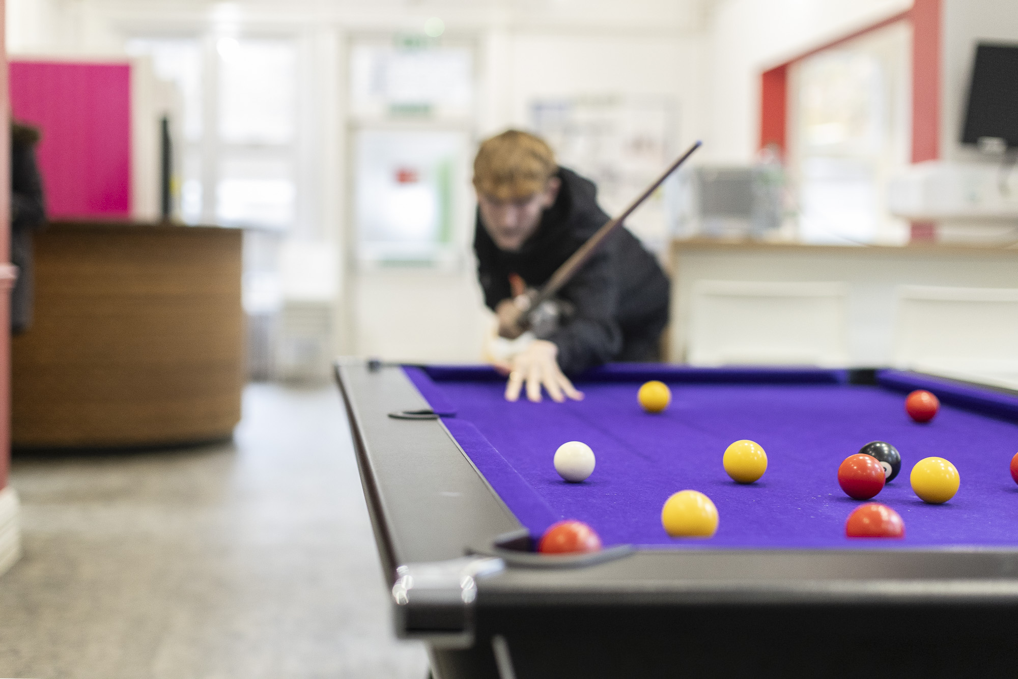 Student playing pool