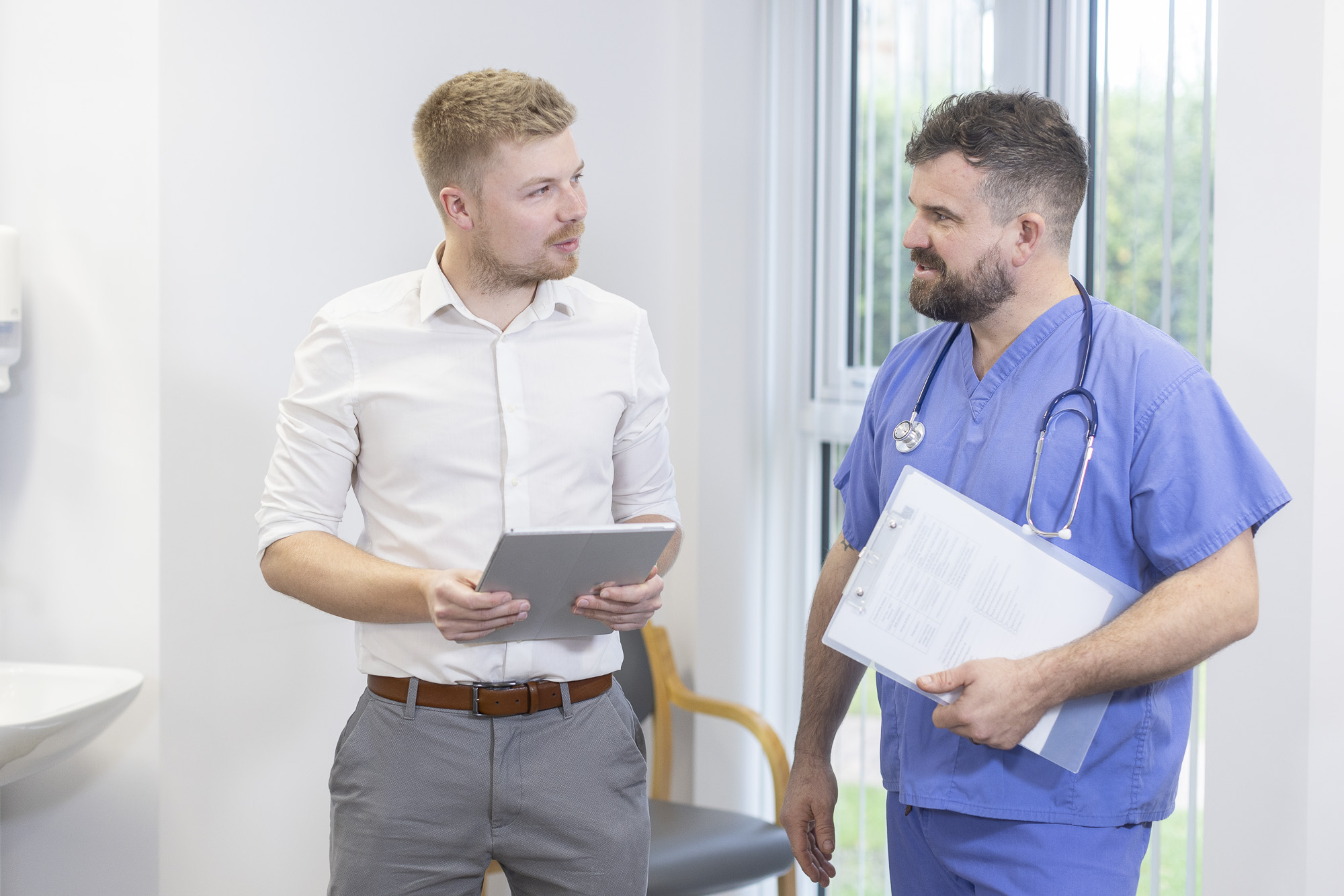 Two male colleagues talking