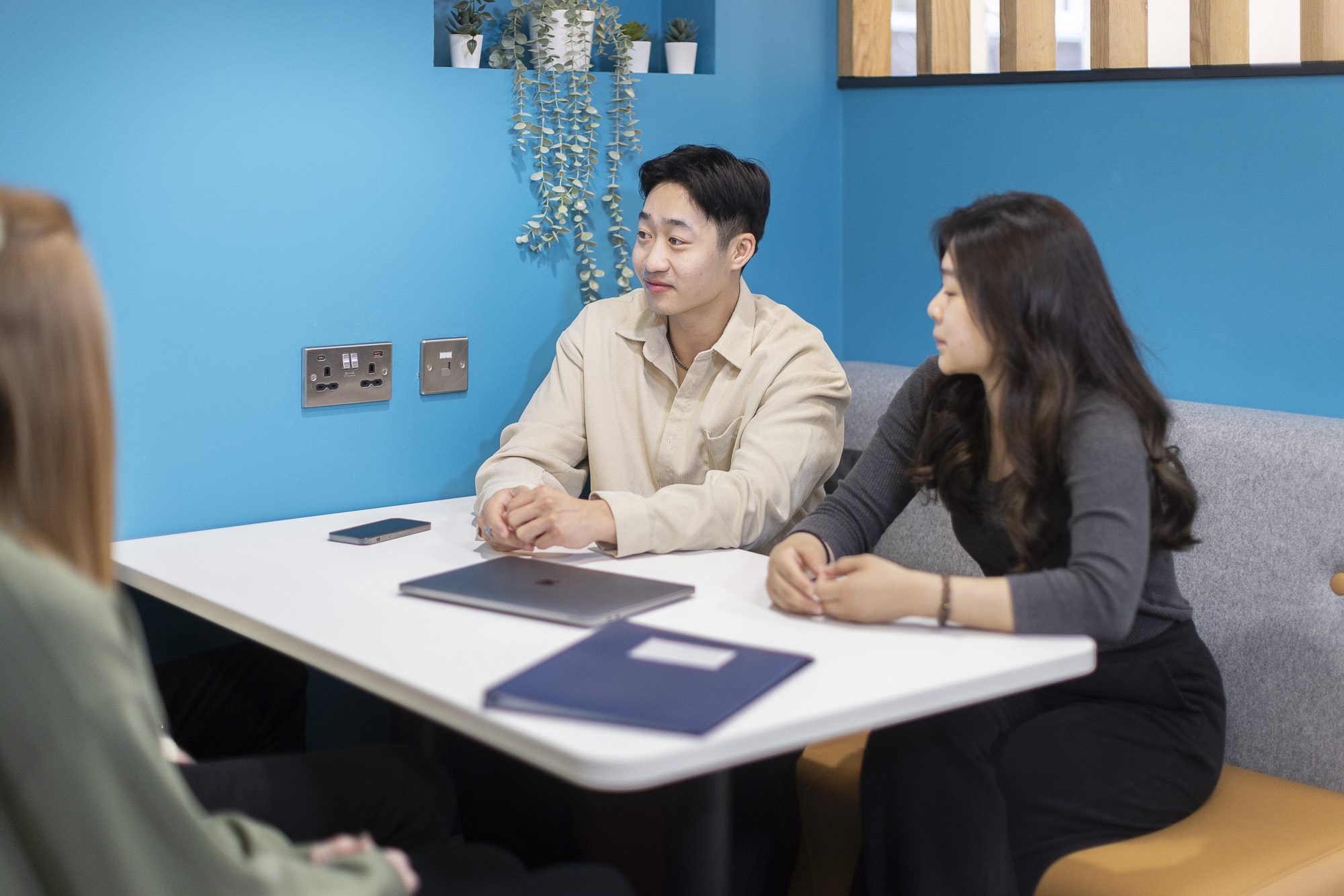 students conversating around a table