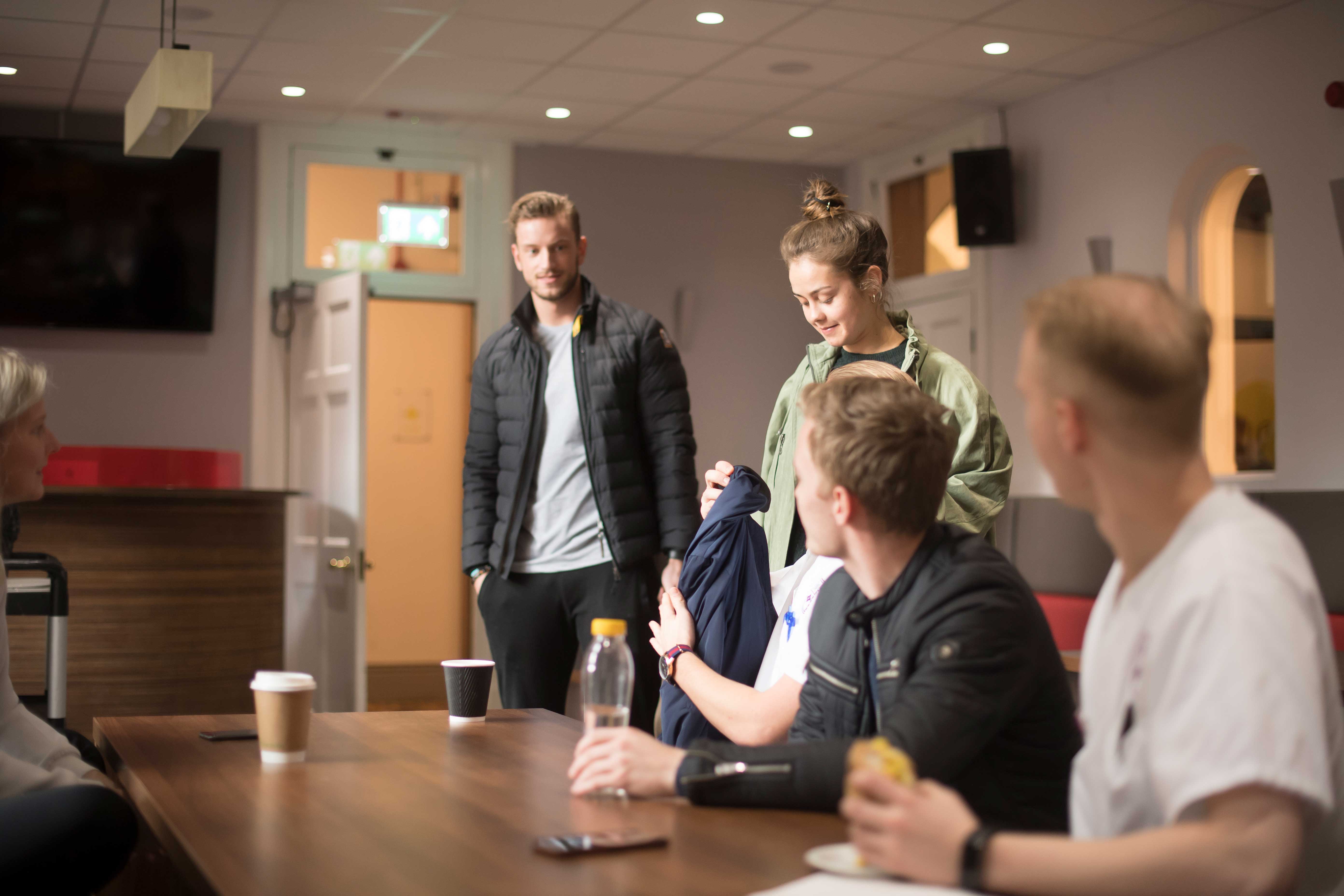 Students sitting in the Refectory