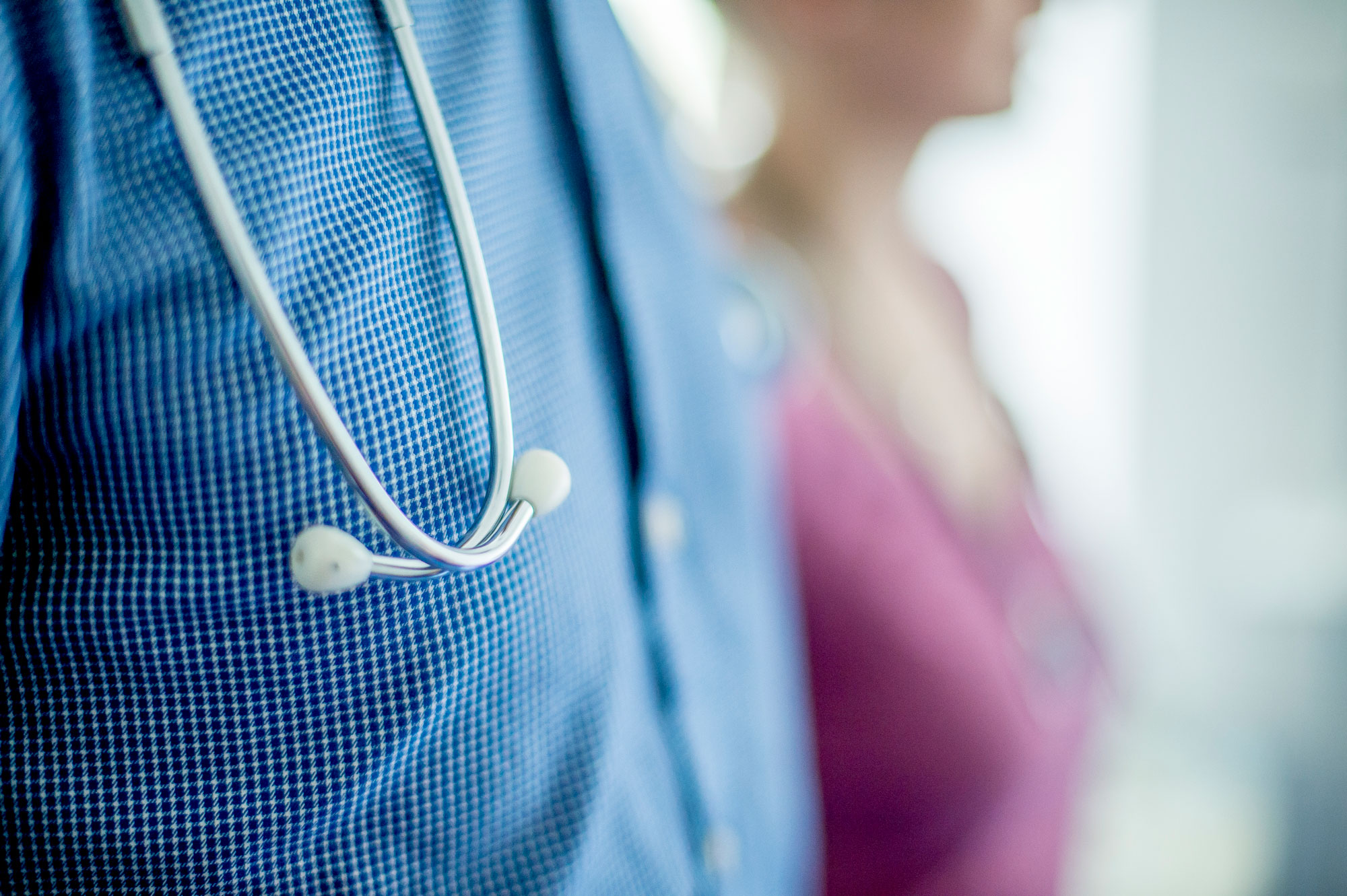 two medical professionals standing together