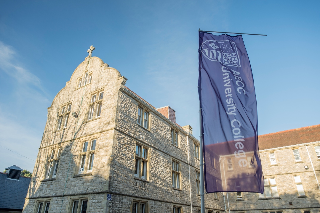 University main building with flag